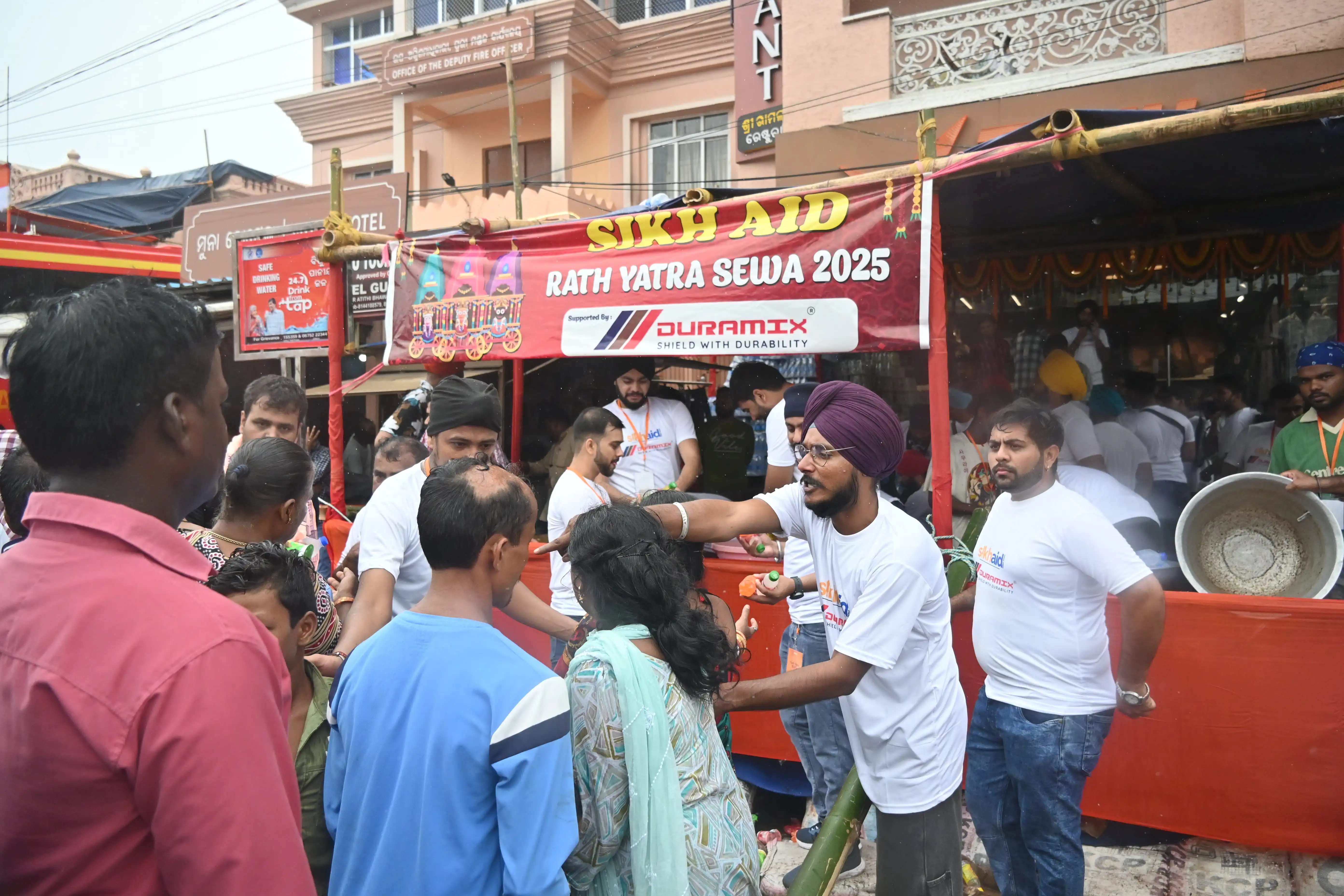 Crowds of devotees on Grand Road during the 2025 Ratha Yatra in Puri