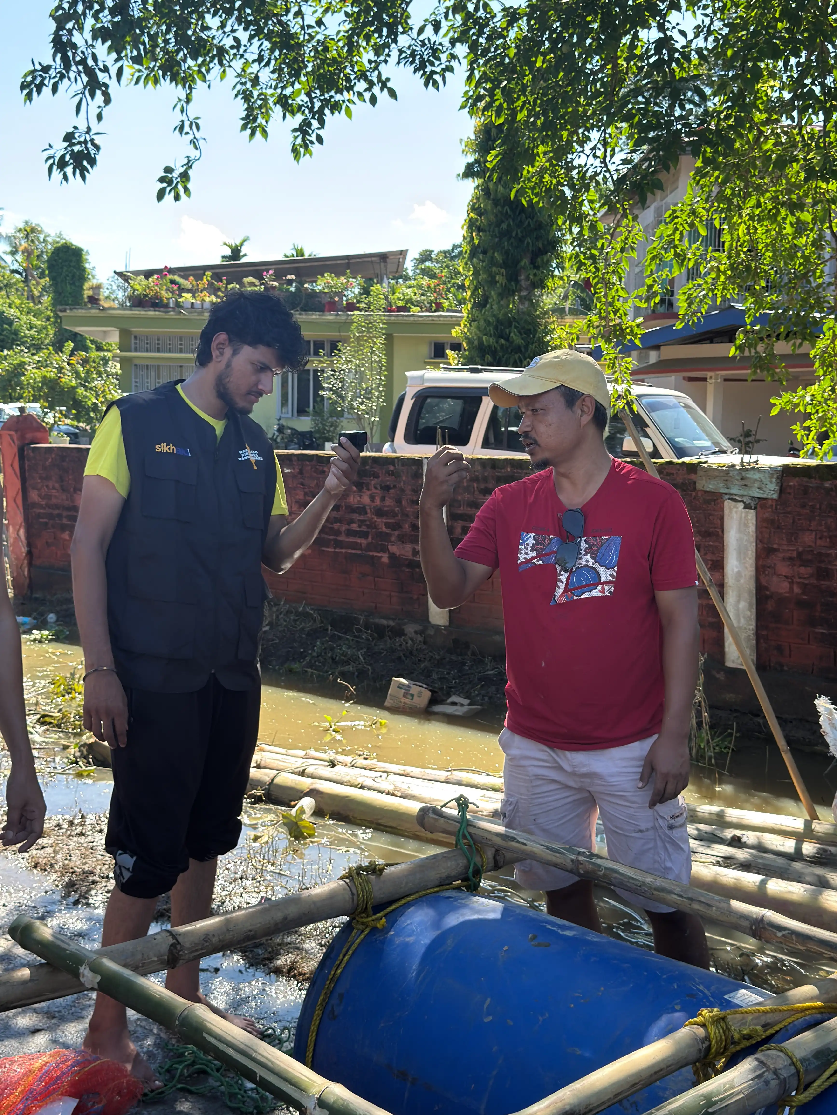 SikhAid team delivering flood relief aid to families affected by the Assam floods